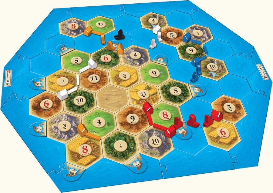 Catan Seafarers board with multiple islands, ships, and sea hexes